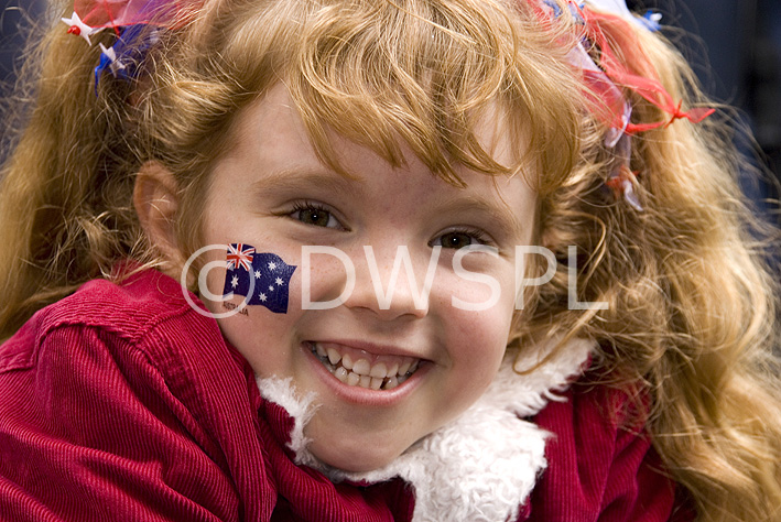 stock photo image: Australia, Australians, NSW, New South Wales, Sydney, People, child, children, girl, DFF, DFFPEOPLE, girls, flag, flags, australian flag, australian flags, smile, smiles, smiling, happy, happiness, Anzac, Anzacs, Anzac Day, Anzac Days, parade, parades, Anzac Day parade, Anzac Day parades, Anzac Day march, Anzac Day marches.