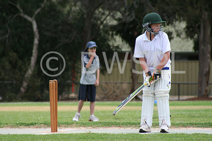 stock photo image: Australia, SA, South Australia, Sport pictures, Sports, cricket, cricket game, cricket games, cricket match, cricket matches, boy, boys, male, males, hat, hats, teenager, teenagers, teenage boy, teenage boys, adolescent, adolescents.