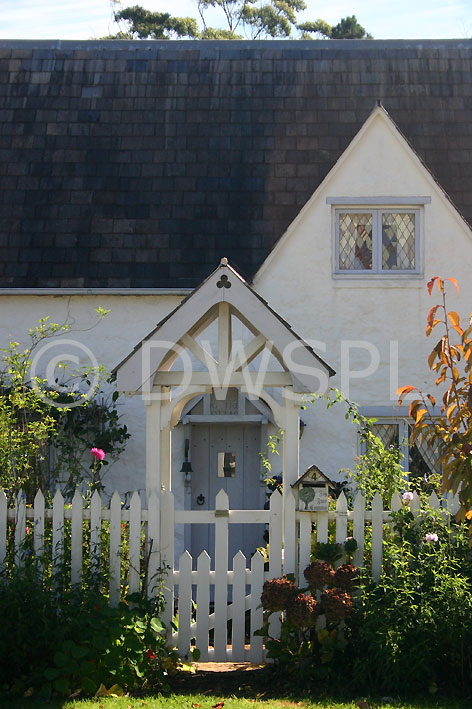 stock photo image: House, houses, housing, architecture, cottage, cottages, fence, fences, garden fence, garden fences, roof, roofs, rooves, door, doors, window, windows.