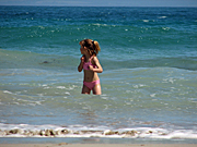 People, child, children, girl, girls, female, females, beach, beaches, surf, wave, waves, shoreline, shorelines, seashore, seashores, coast, coasts, coastal.