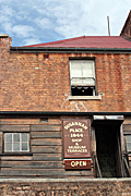 Australia, nsw, sydney, architecture, the rocks, susannah, susannah place, museum, museums, window, windows, sign, signs, roof, roofs, rooves, wall, walls, door, doors.