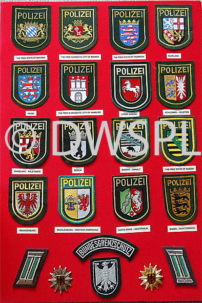 stock photo image: Police, police force, emergency service, emergency services, law, law enforcer, law enforcement, law and order, badge, badges.