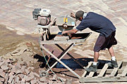 Industry, construction, construction site, construction sites, building, building industry, man, men, male, males, occupation, occupations, saw, saws, paving, paver, pavers, paving stone, paving stones.