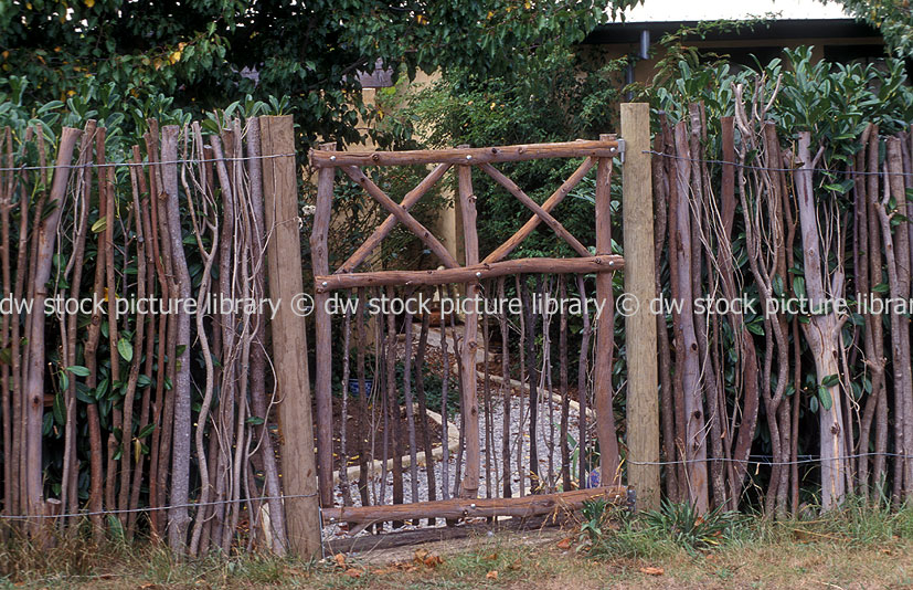 stock photo image: Fence, Fences, Gate, Gates, garden, gardens, garden gate, garden gates, stick, sticks, timber, wood.