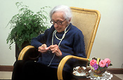 People, woman, women, female, females, old woman, old women, old people, elderly, elderly people, elderly woman, elderly women, jewellery, old, elderly, aged, crochet, crocheting, chair, chairs, rocking, rocking chair, rocking chairs, glasses, spectacles, Royalty Free Image