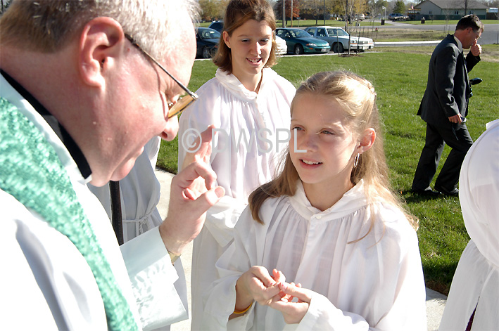 stock photo image: People, child, children, puberty, Religion, religions, religious, religious building, religious buildings, catholic, catholics, catholic religion, roman catholic, roman catholics, roman catholic church, roman catholicism, christianity, christian, christians, faith, spirituality, worship, worships, worshipping, people, child, children, puberty, man, men, male, males, priest, priests, rite of blessing, catholic church, catholic churches, interior, interiors, parish, parishes, mass of ordination, ordination, ordinate, ordinates, consecrate, consecrates, consecrating, holy water, bless, blesses, blessing, child, children, girl, girls, teenager, teenagers, teenage girl, teenage girls, adolescent, adolescents, MM49,