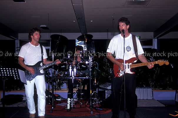 stock photo image: Australia, man, men, male, males, singer, singers, entertainment, band, bands, rock, rock band, rock bands, guitar, guitars, band, bands, sydney, nsw, musical instrument, musical instruments, New South Wales, Australia, sydney, pub, pubs, hotel, hotels, guitarist, guitarists, string, stringed, stringed instrument, stringed instruments, string instrument, string instruments.