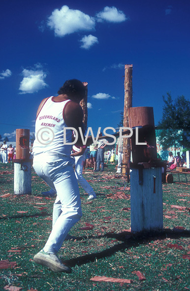 stock photo image: Australia, qld, queensland, Sport pictures, Sports, woodchopping, chop, chops, chopping, woodchopper, woodchoppers, competition, competitions, woodchopping competition, woodchopping competitions, axe, axes, man, men, male, males, outdoors, log, logs.