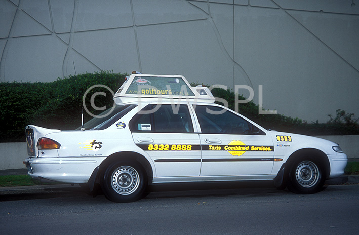 stock photo image: Australia, New South Wales, sydney, sign, signs, road, roads, sealed, sealed road, sealed roads, transport, transportation, vehicle, vehicles, car, cars, vehicle, vehicles, taxi, taxis, cab, cabs, taxicab, taxicabs, taxi cab, taxi cabs, taxi rank, taxi ranks, cab rank, driver, cab drivers, hubcaps, hub cap, hub caps, cap, caps, Royalty Free Image