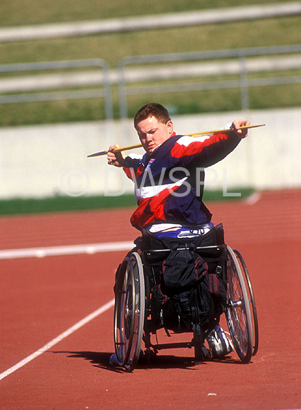 stock photo image: Australia, people, man, men, male, males, outdoors, disabled, disability, disabilities, disabled people, medical equipment, wheelchair, wheelchairs, athlete, athletes, disabled sports, competition, competitions, compete, competing, paralympic, paralympics, paraplegic, paraplegics, handicapped, handicapped people, javelin, javelins.