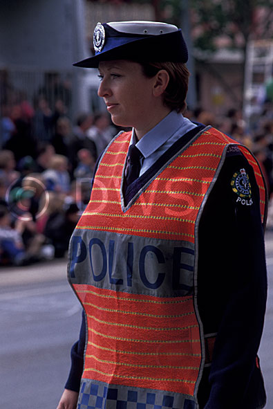 stock photo image: People, occupation, occupations, police, police force, emergency service, emergency services, law, law enforcer, law enforcement, law and order, policewoman, policewoman, woman, women, female, females, south australia, adelaide, SA, Australia, hat, hats, uniform, uniforms, police uniform, police uniforms.