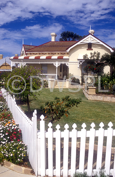 stock photo image: House, houses, housing, architecture, roof, roofs, rooves, federation house, federaton houses, render, rendered, cement render, cement rendering, garden, gardens, fence, fences, garden fence, garden fences, picket, picket fence, picket fences, wood, wooden, timber, chimney, chimneys, cloud, clouds.