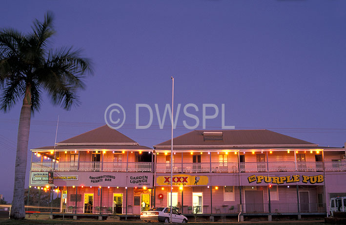 stock photo image: Australia, qld, queensland, normanton, pub, pubs, purple pub, hotel, hotels, architecture, tree, trees, palm, palms, palm tree, palm trees.