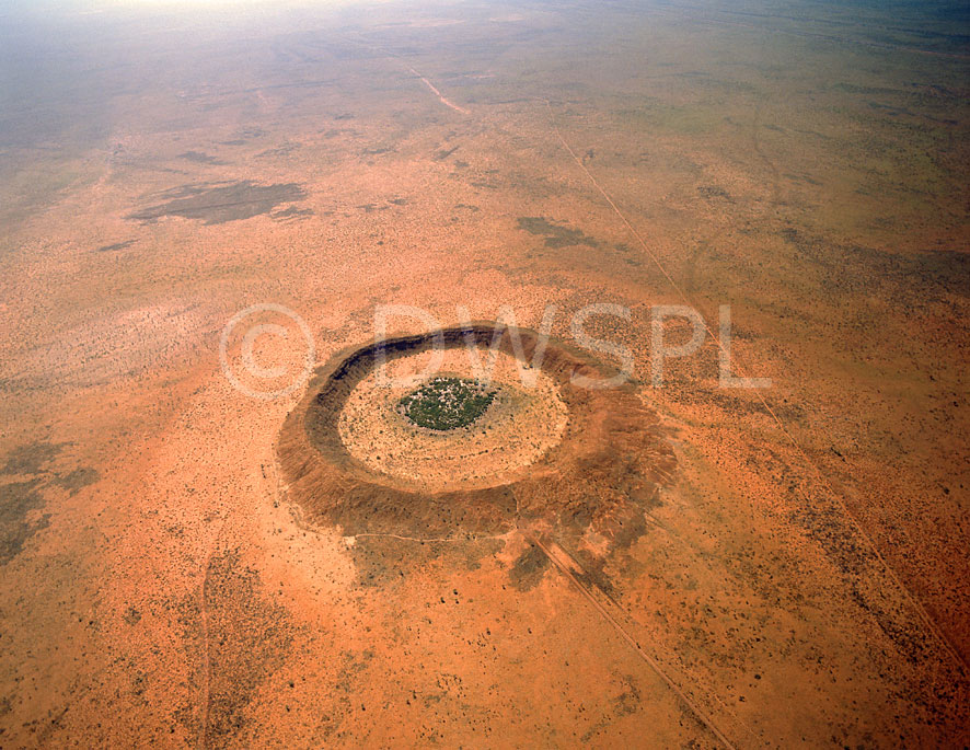 stock photo image: Australia, Australian, Australian desert, Australian deserts, wa, western australia, aerial, aerials, crater, craters, wolfe creek, wolfe creek crater, kimberley, kimberleys, desert, deserts, desert scenes, national parks, wolfe creek crater national park, kandimalal, meteorite, meteorites, meteorite crater, meteorite craters, Great Sandy Desert, Great Sandy, Kimberley, kimberleys, the kimberleys, outback, australian outback, outback australia.