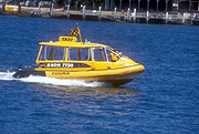 Transport, transportation, vehicle, vehicles, boat, boats, boating, taxi, taxis, taxi cab, taxi cabs, cab, cabs, water, water scene, water scenes, flag, flags, water taxi, water taxis, australia, Sydney, Sydney Harbour, Sydney Harbor, NSW, New South Wales, sign, signs.