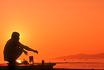 Man, men, male, males, fisherman, fishermen, sunset, sunsets, sunrises and sunsets, jetty, jetties, pier, piers, silhouette, silhouettes.