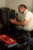 People, indoors, man, men, male, males, indoors, occupation, occupations, television, televisions, technician, technicians, repair, repair television, repair televisions, repairing television, repairing televisions, tool, tools, toolbox, toolboxes, tool box, tool boxes, Australia, Sport pictures, Sports, balloon images, hot air balloons