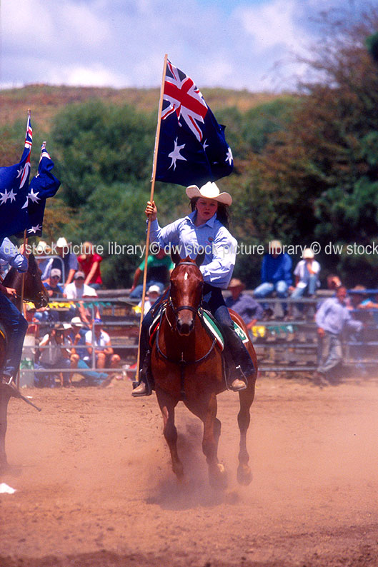 stock photo image: Australia, australian, people, nsw, new South Wales, Sport pictures, Sports, rodeo, rodeos, cowboy, cowboys, cowgirl, cowgirls, horse, horses, animal, animals, flag, flags, australian, australian flag, australian flags, hat, hats.