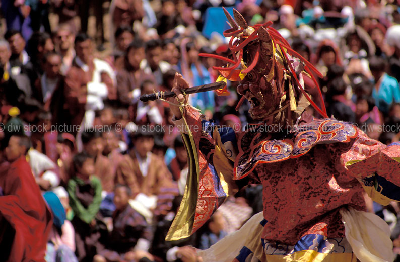 stock photo image: Bhutan, Tungam, Deities, Dance of the terrifying deities, terrifying deities, dance, dances, dancer, dancers, dancing, paro, paro festival, festival, festivals, crowd, crowds, audience, audiences, spectator, spectators, entertainment, costume, costumes.