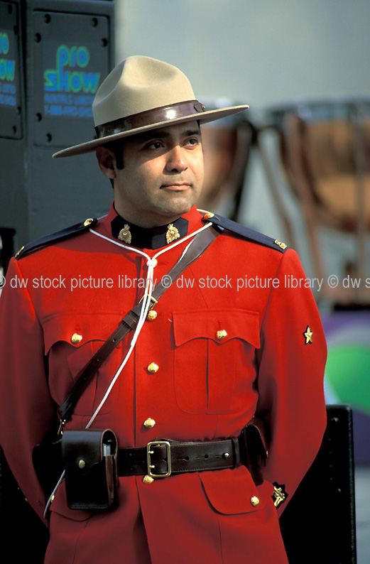 stock photo image: Canada, Vancouver, british columbia, Mountie, Mounties, RCMP, Royal Canadian Mounted Police, Mounted Police, police, police force, emergency service, emergency services, law, law enforcer, law enforcement, law and order, man, men, male, males, policeman, policemen, Canadian Mountie, Canadian Mounties, uniform, uniforms, hat, hats, festival, festivals, dragonboat festival, dragonboat festival, dragon boat festival, dragon boat festivals.