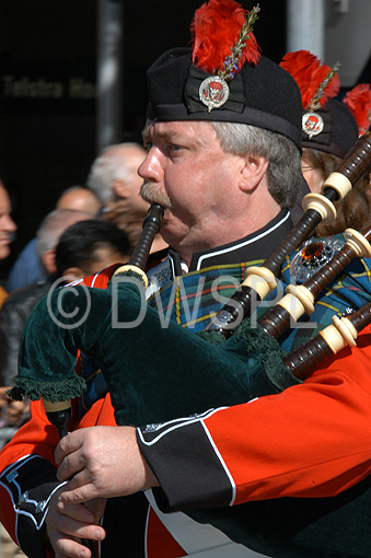 stock photo image: Australia, New South Wales, sydney, band, bands, scottish, scottish band, scottish bands, man, men, male, males, Anzac Day, Anzac Days, parade, parades, Anzac Day parade, Anzac Day parades, uniform, uniforms, bagpipes, musical instrument, musical instruments.