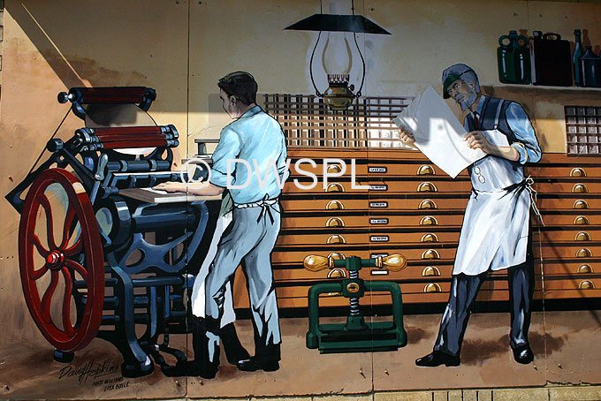 WALL MURAL DEPICTING AN OLD FASHIONED PRINTER'S SHOP IN THE TOWN OF