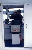 Australia, New South Wales, people, man, men, male, males, boat, boats, boating, binoculars, door, doors, control, controls, interior, interiors.