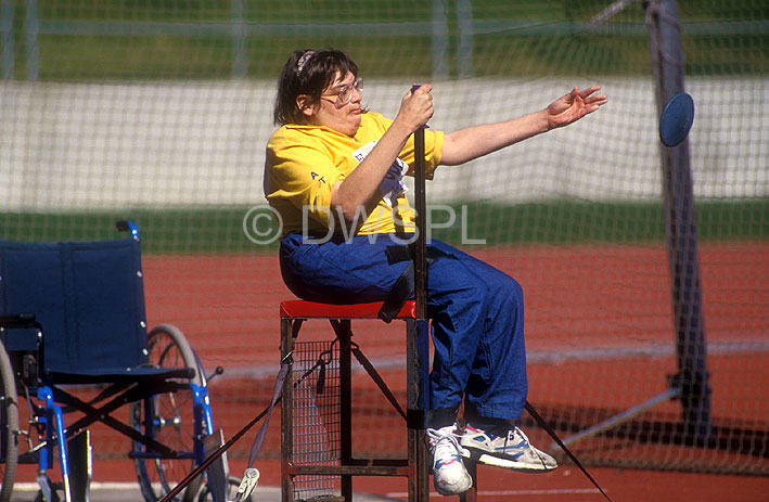 stock photo image: Australia, Sport pictures, Sports, woman, women, female, females, disabled people, disabled, disability, disabilities, disabled sport, disabled sports, australia, handicapped, handicapped people, handicapped sports, paraplegic, paraplegics, athlete, athletes, discus, discus throwing.