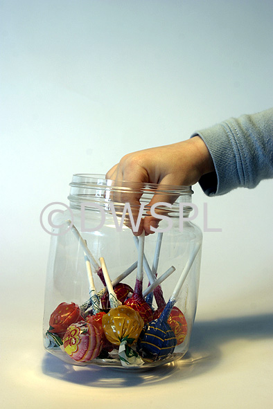 stock photo image: Food, Sweet, Sweets, candy, candies, child, children, hand, hands, jar, jars, glass, glass jar, glass jars, pj38,