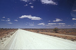 Australia, Australian, Australian desert, Australian deserts, road, roads, unsealed road, unsealed roads, dirt road, dirt roads, desert, deserts, desert scenes, Australia, cloud, clouds, sky, skies, sky scenes, HOL08,