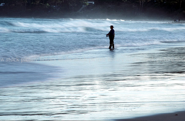 stock photo image: Sport pictures, Sports, fishing, coast, coasts, coastline, coastlines, water, sea, seas, ocean, oceans, beach, beaches, beach fishing, wave, waves, surf fishing, HOL08,